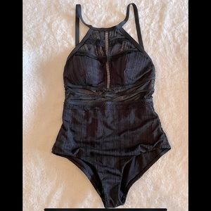 Black one-piece with sheer waist and design top